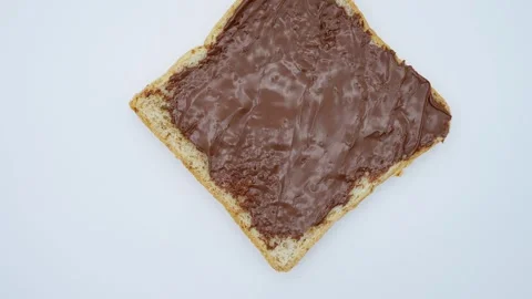 Whole Wheat  Bread With Chocolate Paste, On White Background Rotated. Stockbeeldmateriaal 249576100