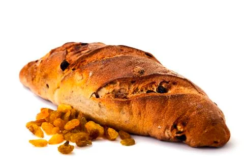 Whole wheat bread with nuts and raisins on white background. food Foto stock