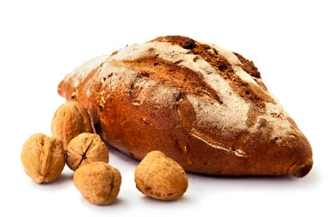 Whole wheat bread with nuts on white background. food Foto stock
