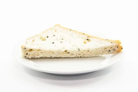 Whole wheat  bread section sliced on white plate Stock Photos