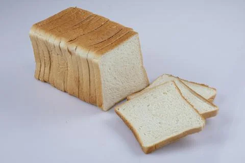 Whole wheat bread slices on a white background Stock Photos