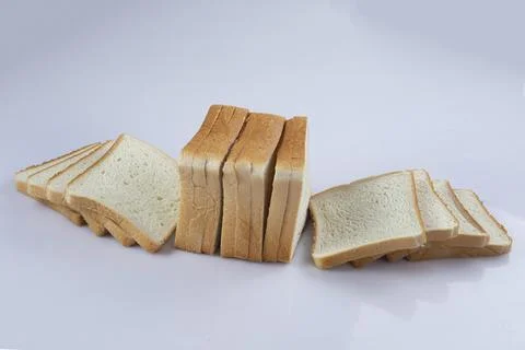 Whole wheat bread slices on a white background Stock Photos