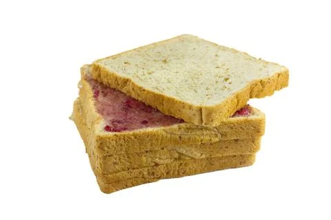 Whole wheat bread stack with grape jam on isolated white background. Stock Photos