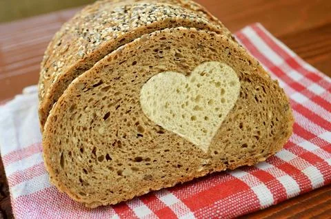 Whole wheat bread with a white bread heart Stock Photos