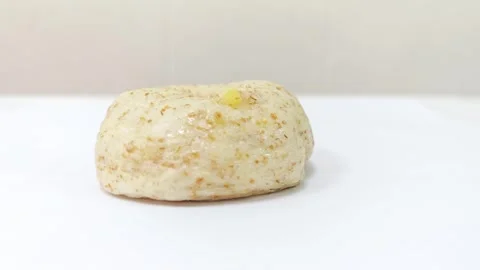 Whole wheat grain bagel isolated on white background. Video stock 343121561