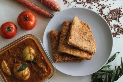 Whole wheat Indian flat bread made of grated carrots and powdered flax seed s Stock Photos