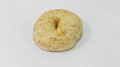 Whole wheat multigrain bagel isolated on white background. Stock Footage 343121969