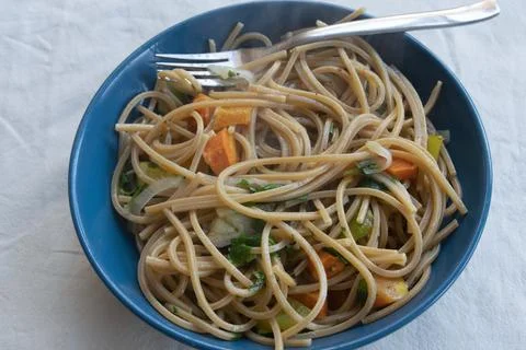 Whole wheat spaghetti with vegetables Stock Photos