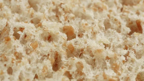 Wholemeal bread macro close up presentation slowly rotating stock footage Stock Footage 344686422