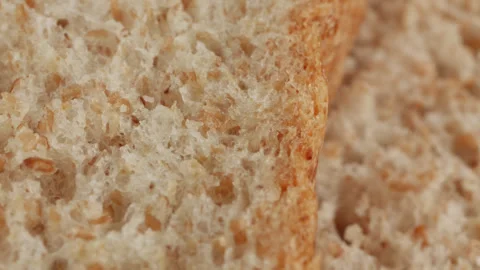 Wholemeal bread macro close up presentation slowly rotating stock footage Stock Footage 344686859