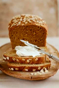 Wholemeal bread with soft cheese Stock Photos