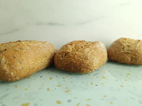 Wholemeal buns on table Stock Photos