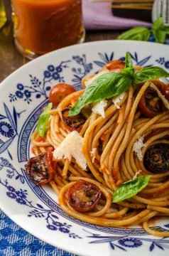 Wholemeal pasta with roasted tomato Stock Photos