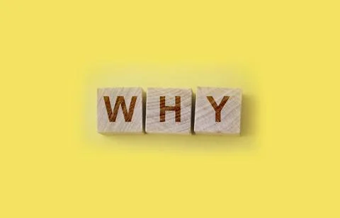 WHY cube blocks arranged on yellow background. Cause and consiquence concept Stock Photos
