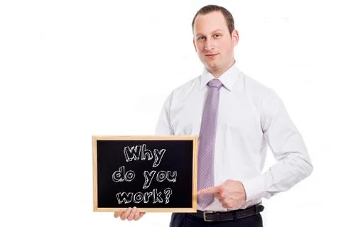 Why do you work? - Young businessman with blackboard Stock Photos