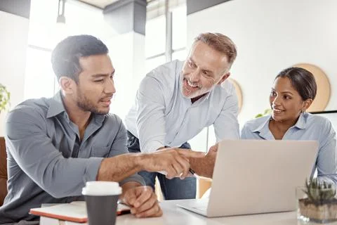 Why dont we tweak it a bit here. a group of businesspeople using a laptop in a Stock Photos