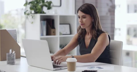 Why isnt it working. 4k video footage of a young businesswoman banging on her 库存影片 201061162