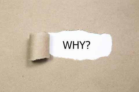 WHY? word under torn paper Stock Photos
