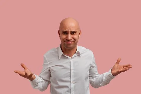 Why you do this. Horizontal shot of bald guy with bristle. With puzzled expre Stock Photos