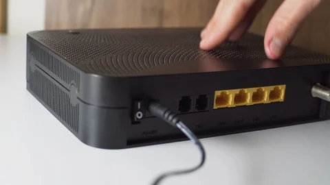 Wi-Fi Modem Electronic Device Repairment with Micro Screwdriver Stock Footage 129410381