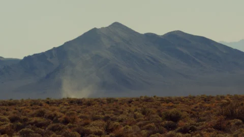 Wicked dust devil tears across a desert plateau. Stock Footage 265908311