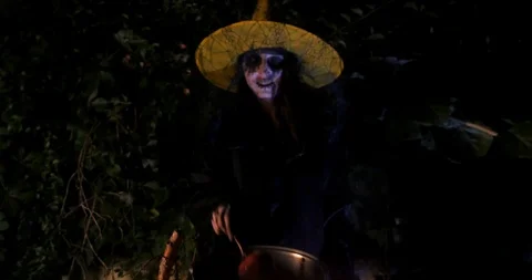 Wicked Witch show enchanted apple in Halloween Horror Scene Stock Footage 94836743