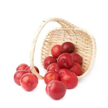 Wicker basked filled with plums Stock Photos