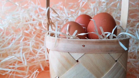 Wicker basket with brown chicken eggs Stock Footage 104654308