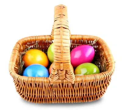 Wicker basket with colorful easter eggs Foto stock
