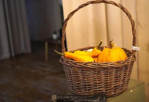 Wicker basket with different types of pumpkins as a decoration for Thanksgi.. 写真素材