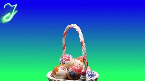 A wicker basket with Easter eggs. Appears the text "Happy Easter" Stock-Footage 74273829