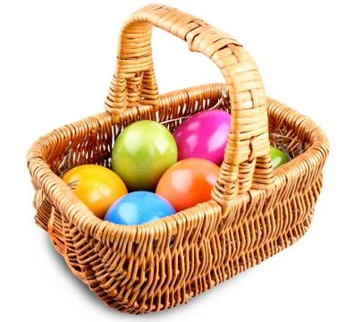 Wicker basket full of colorful easter eggs Stock Photos