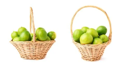 Wicker basket full of multiple ripe limes, composition isolated over the white Stock Photos