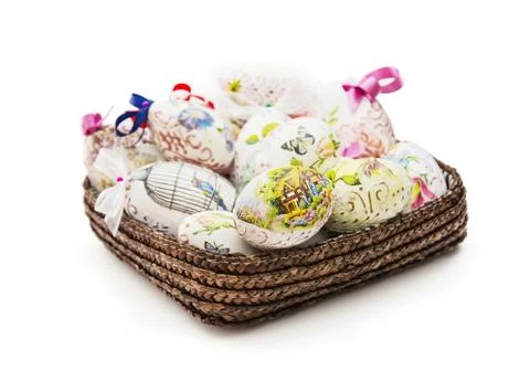 Wicker basket full of various Easter eggs Foto stock