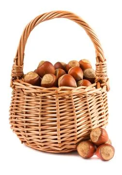 Wicker basket with hazelnuts Stock Photos