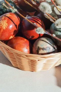 Wicker Basket with Naturally Dyed Easter Eggs and Pussy Willow Branches in .. Stock Photos