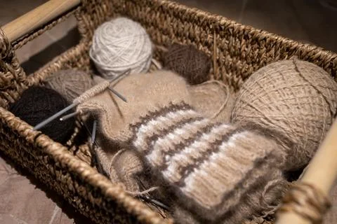 Wicker basket with needlework, inside yarn for knitting socks Stock Photos