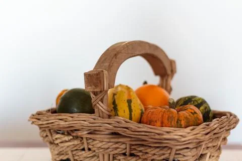 Wicker basket with pumpkins of different varieties Stock Photos