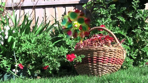 A wicker basket with small ornamental windmill. Stock Footage 22907441