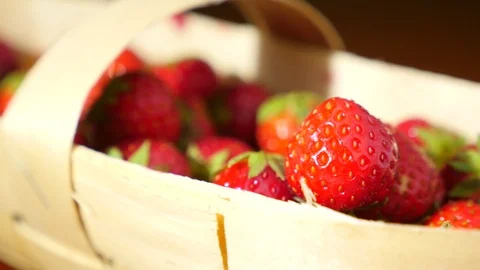 Wicker basket with strawberry on the table, close-up 4k, dolly movement Stock Footage 80853072