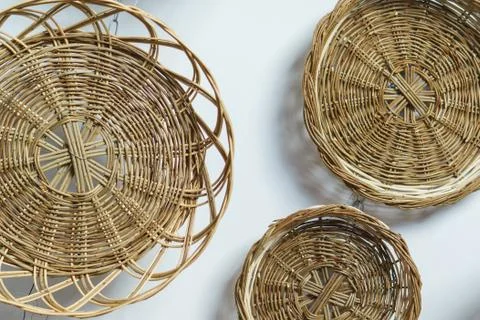 Wicker basket on the wall close up Stock Photos