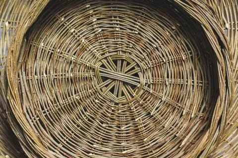 Wicker basket on the wall close up Stock Photos