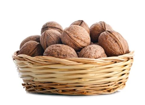 Wicker basket with walnuts Stock Photos