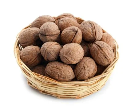 Wicker basket with walnuts Stock Photos