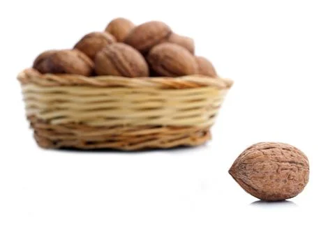 Wicker basket with walnuts Stock Photos