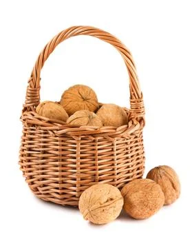 Wicker basket with walnuts Stock Photos