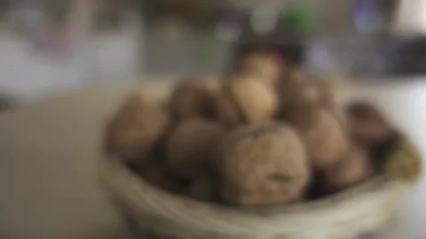 Wicker basket with walnuts on the table. Stock Footage 197315224