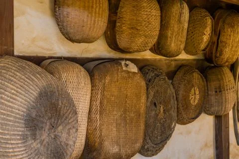Wicker baskets hanging on wall Stock Photos