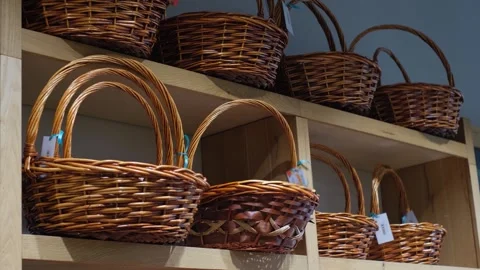 Wicker baskets made of rattan or other material on a store counter Stock Footage 278291713