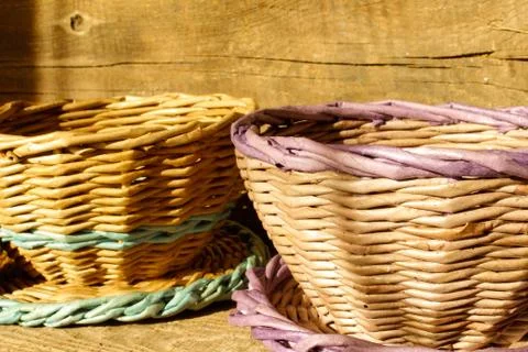 Wicker baskets on a wooden background Stock Photos